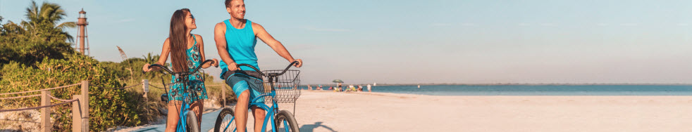 Florida beach couple biking bikes